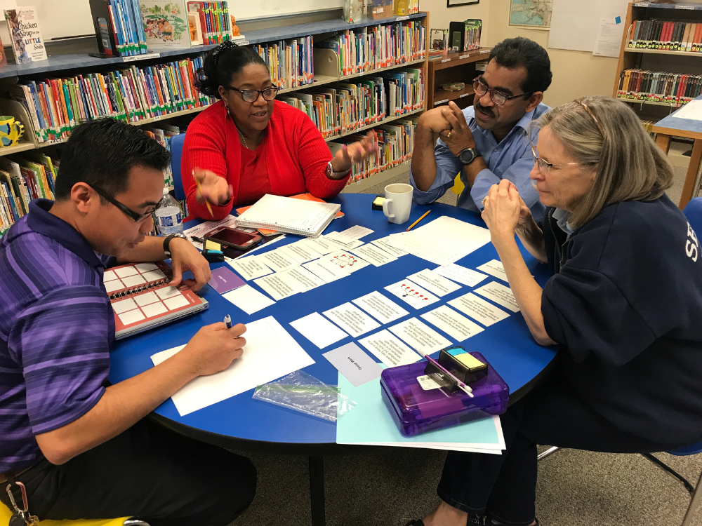 Teachers collaborating around a table